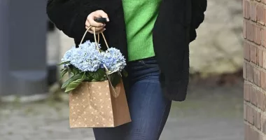 Coleen Rooney cuts a casual figure as she picks up flowers while running errands in Cheshire 