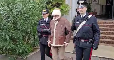 Fugitive mafia mobster Matteo Messina Denaro (pictured being detained by police on Monday) had a poster of the classic movie The Godfather on the wall of his secret bunker