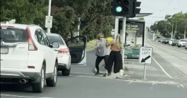 Footage has captured the moment two women exchanged blows on a busy road in front of horrified motorists