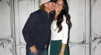 Chip Gaines kisses Joanna Gaines on the cheek.