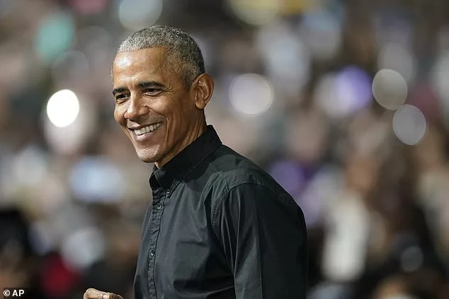 Barack Obama is seen at a rally for Senator Raphael Warnock in Atlanta on December 1. The former president's spokeswoman would not say whether he is now checking whether classified material has been mistakenly kept in his own residences
