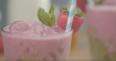 This vibrant matcha drink is sweetened with strawberry milk