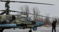 Ukraine has destroyed three Russian helicopters in just half an hour (pictured: a serviceman checks a Ka-52 attack helicopter in Luhansk this month)