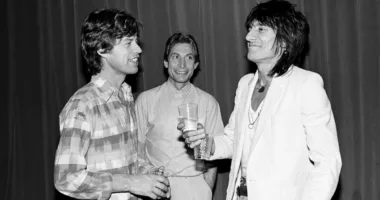Rolling Stones members Mick Jagger (from left), Charlie Watts, and Ronnie Wood attend a party in New York City in 1980.