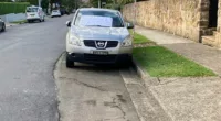 Drummoyne resident Roza McQueen left a passive aggressive note on the windscreen of a car (above) parked in front of her home after it blocked roadwork