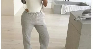 Kim Kardashian flashes skin in bodysuit with gray sweats for striking mirror selfie