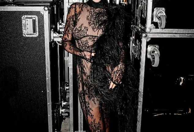 Rita Ora looks incredible in semi-sheer lace dress and feather shawl