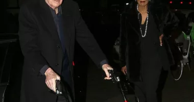 Sir Michael Caine, 89, uses a walking frame with wife Shakira, 75, at a London restaurant