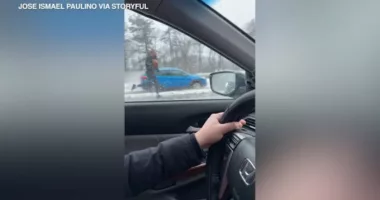 Video shows man darting through highway traffic to help driver having medical emergency on Massachusetts highway