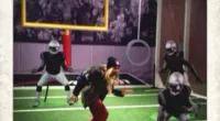 Is there anything she can't do?! Beyoncé showed off her silly side as she pretended to tackle a lifesize cardboard cut-out NFL player as she got into the spirit of Super Bowl Sunday