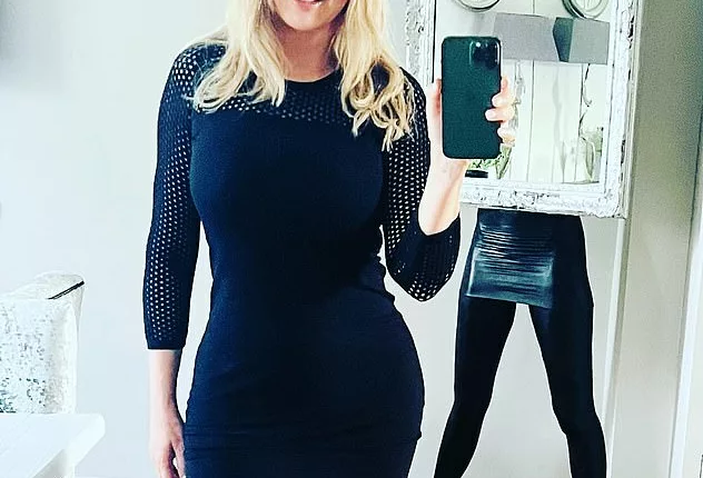 Carol Vorderman shows off her incredible figure in a fitted black dress