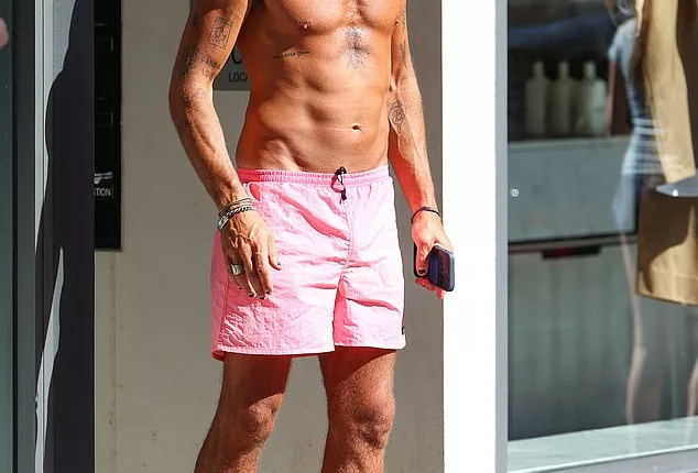 Tim Tregoning, 40, (pictured), the estranged husband of Pip Edwards' PE Nation co-founder Claire Tregoning, revealed a tattoo of his ex-wife's name as he went shirtless in Bondi on Friday