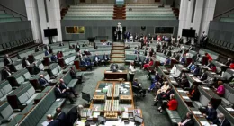 A parliamentary staffer has been injured in the chamber as Coalition MPs scrambled to exit the room