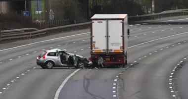 A driver smashed his car into a lorry on the M25 near Heathrow Airport just before midnight. He was taken to hospital with life-threatening injuries