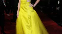 Mellow yellow: Elizabeth Banks lights up a gloomy night in a Jason Wu gown at the UK premiere of The Hunger Games: Catching Fire