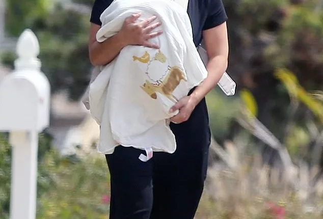 New mom: Gina Rodriguez was seen for the first time since giving birth to her first child on a walk with her newborn in Los Angeles, California on Saturday afternoon