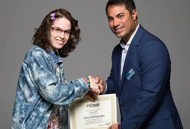 Audrey Hale receiving a certificate at Nossi College of Art in Nashville