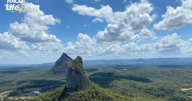 A woman has died and two others have been injured during a horror weekend at the Mount Beerwah, on Queensland