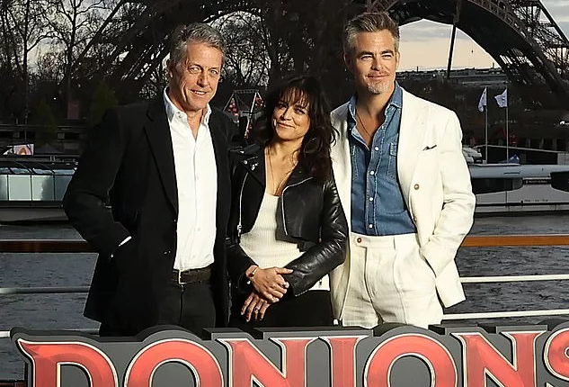Dashing! Hugh Grant, Michelle Rodriguez and Chris Pine promoted their new film Dungeons and Dragons in Paris on Tuesday