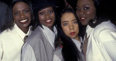 XSCAPE poses together during event. Kandi Burruss says the group