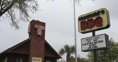 Lawsuit: Slurs, coercion at BBQ chain with racist history