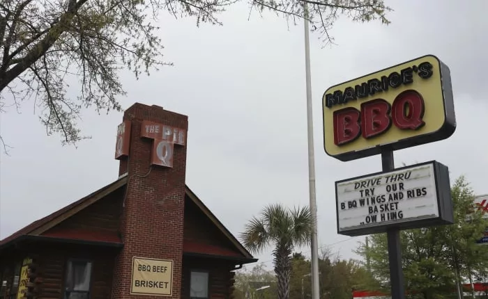 Lawsuit: Slurs, coercion at BBQ chain with racist history