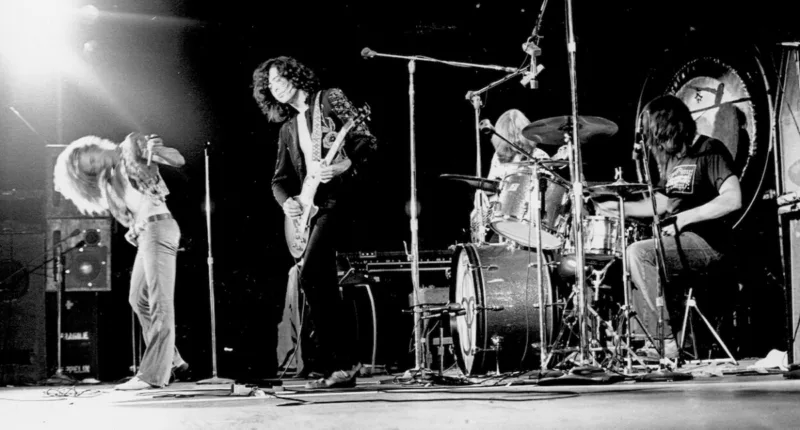 Led Zeppelin members (from left) Robert Plant, Jimmy Page, John Paul Jones (background), and John Bonham perform in concert in 1973.