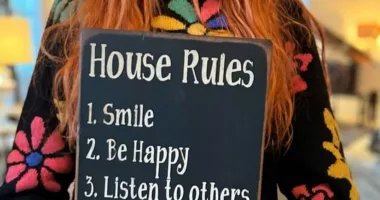 Madonna shows off a sign with five simple household rules she wants her family to follow
