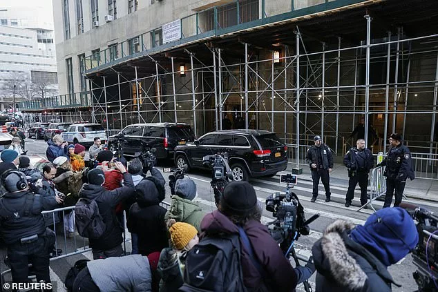 Members of the media gather as police officers stand outside Manhattan Criminal Court on Thursday after former President Donald Trump