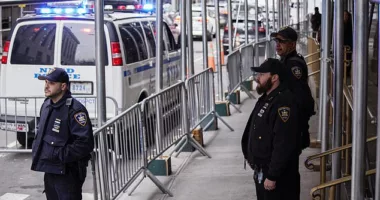 New York State Court policemen get ready for the arrival of the Manhattan District Attorney Alvin Bragg at his office on Friday