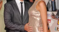 Tactile: Peter Andre tenderly strokes his girlfriend Emily MacDonagh's baby bump at the Pride Of Britain Awards