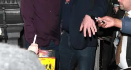 In demand: Quentin Tarantino was mobbed by fans as he left the London Palladium on Saturday night following a live conversation event for his new book