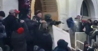 New January 6 Footage Appears To Show Capitol Police Officer Aiming Rifle At Crowd