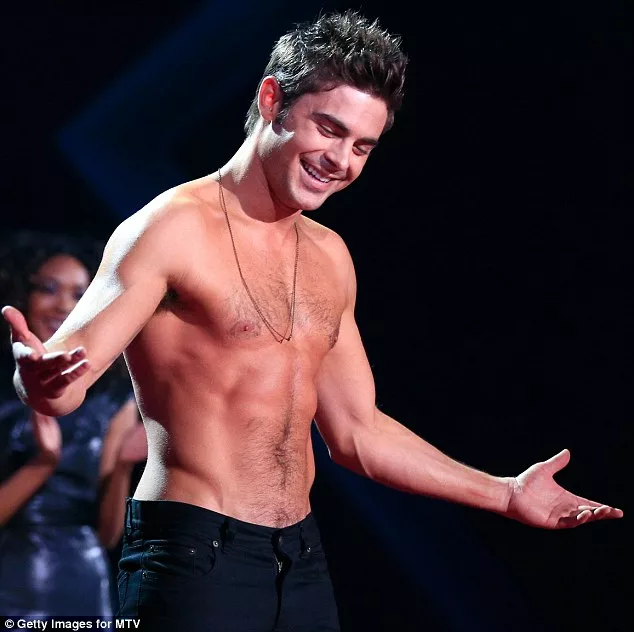 Zac l'orange: Efron's pale face did not match his tangerine torso at the MTV Movie Awards on Sunday