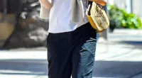 Dakota Fanning keeps casual in capri pants and a basic T-shirt as she enjoys a sunny stroll in Los Angeles