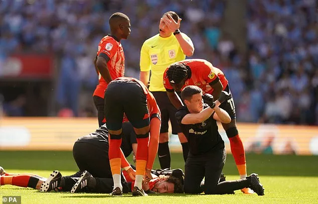 Luton star Tom Lockyer suffered a worrying injury in Saturday's Championship play-off final