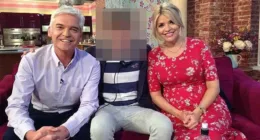 Sources have told the Daily Mail that Schofield's much younger former lover was given a payment from ITV when the on-off affair ended. Pictured: The young man sat with Phillip Schofield and Holly Willoughby