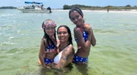 Teen Mom Briana DeJesus shows off fit figure and massive tattoos in white bikini for boat ride with two daughters