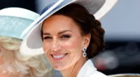 Kate Middleton, who may wear certain colors but avoid others with her 2023 Trooping the Colour outfit, smiles wearing a white outfit at Trooping the Colour in 2022
