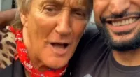 The singer (left) has been slammed on social media for the comment which he made when the two met at a concert in the Bolton Wanderers football stadium in Khan