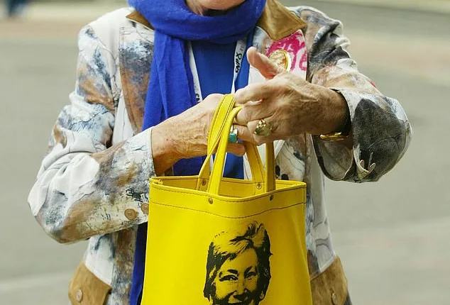 Former Scottish National Party MP Winnie Ewing with an old campaign bag on the first day of the party conference in Aviemore