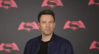 Ben Affleck posing in a black jacket at a photocall for 'Batman v Superman: Dawn of Justice'.