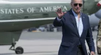 President Joe Biden waves as he walks to board Air Force One as he heads to California