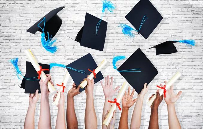 Group of Hands Holding Diplomas and Throwing Graduation Hats