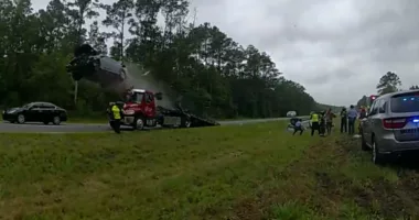 Car launches off tow truck in Georgia: Stunning crash on video