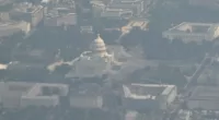 In this aerial view taken from Air Force One, the US Capitol is under hazy skies in Washington, DC