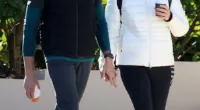 Former NSW premier Gladys Berejiklian (pictured right) and her barrister boyfriend Arthur Moses (left) have been pictured hand-in-hand taking an early morning stroll in activewear