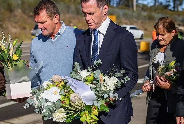 NSW Premier Chris Minns leaves flowers at the site of the crash. A fundraiser has seen more than $242,000 in donations