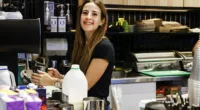 The minimum wage will increase to $23.23 an hour or $882.80 a week. Pictured is a cafe worker in Sydney