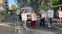 Just Stop Oil protesters were drenched in water by a furious Londoner standing on a balcony this morning as they held up yet more traffic in London